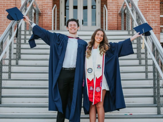 Grads on Old Main stairs