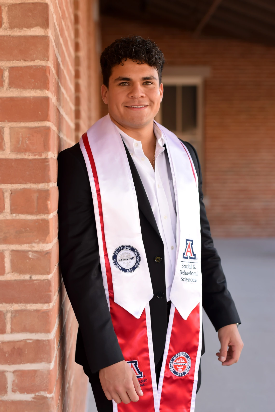 Grad on Old Main veranda