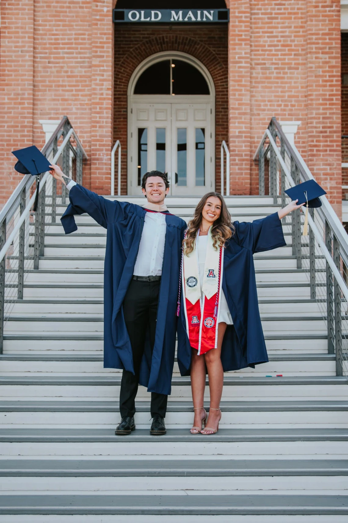 Grads on Old Main stairs