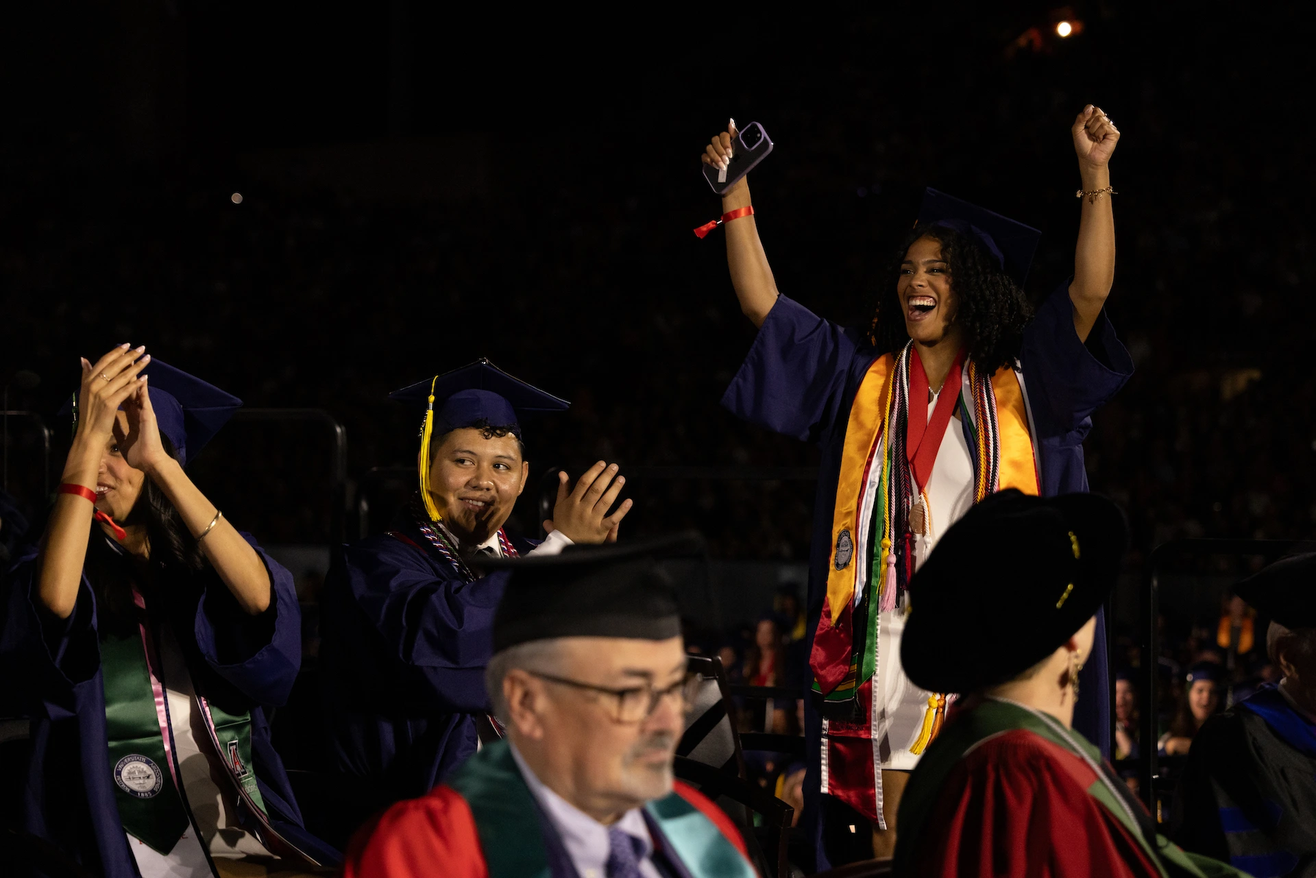 Awardees celebrating on stage